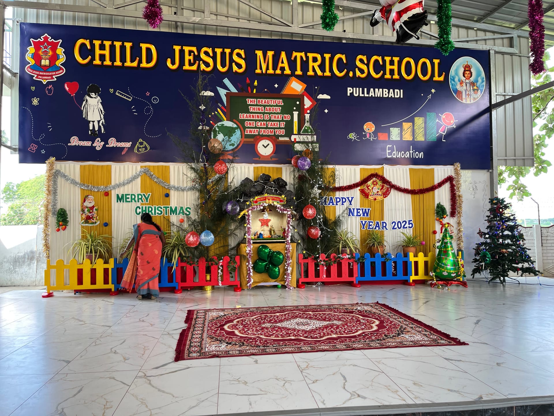 Students on stage at Child Jesus Matriculation School, Pullambadi